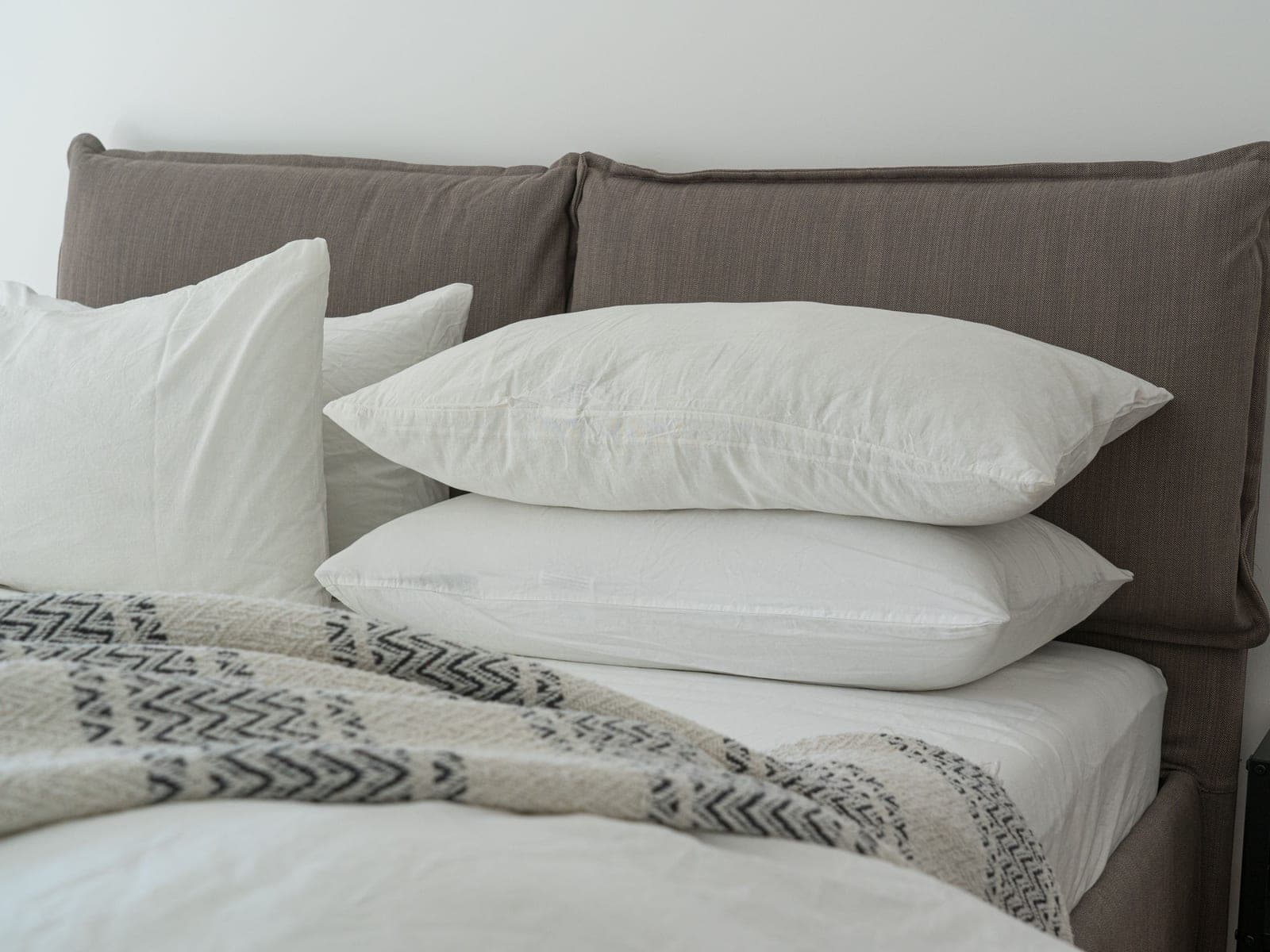 A bed made up with crisp white bed linen