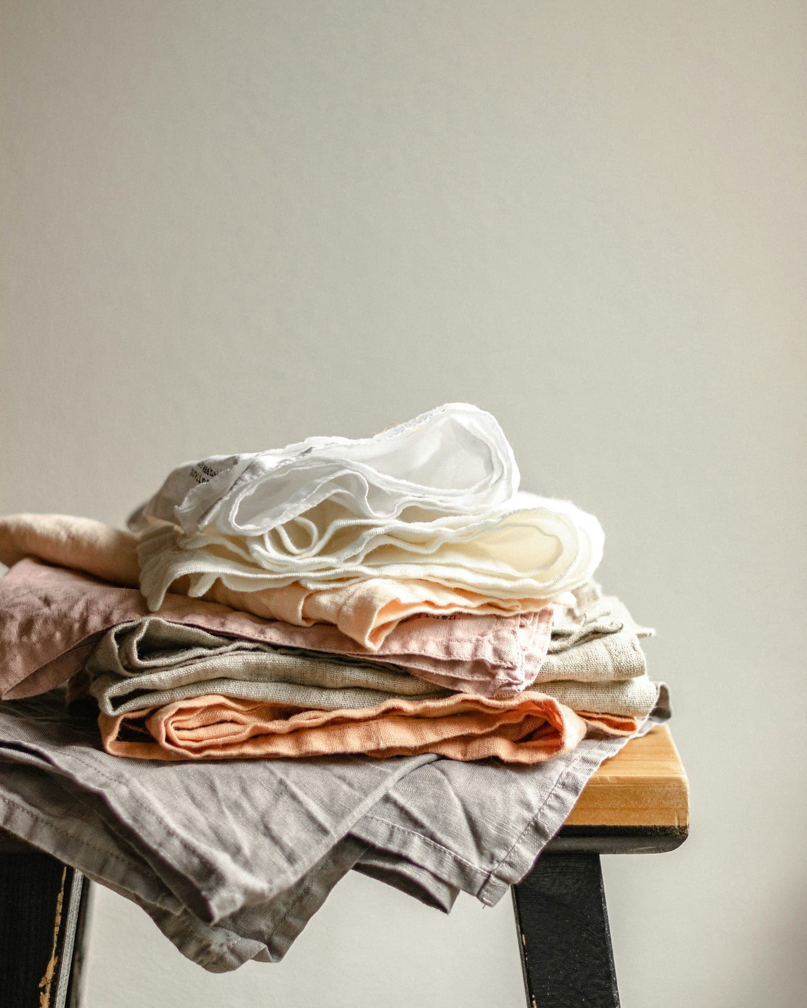 Freshly laundered linen stacked for changeover