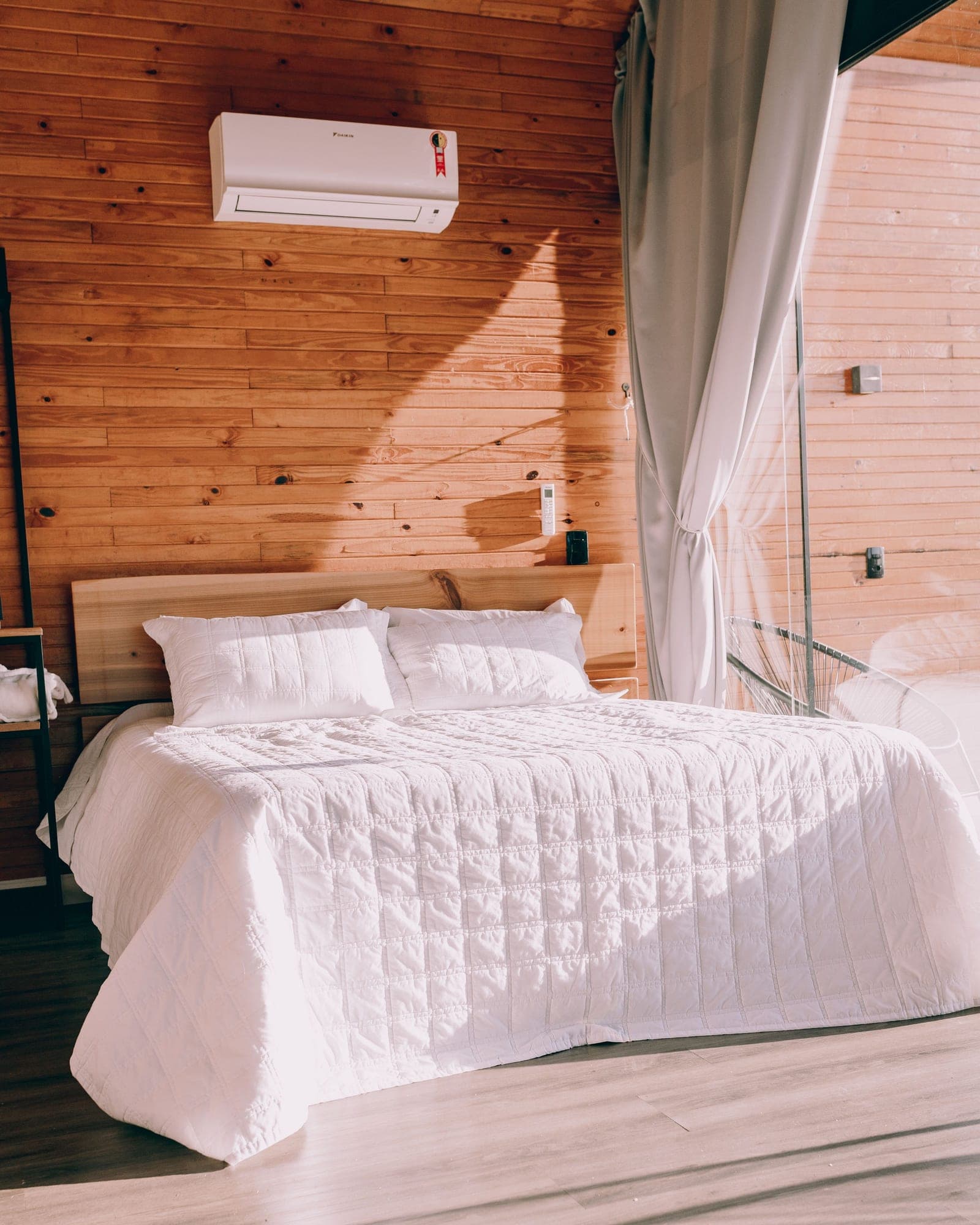 Ivory quilted bedspread on a double bed