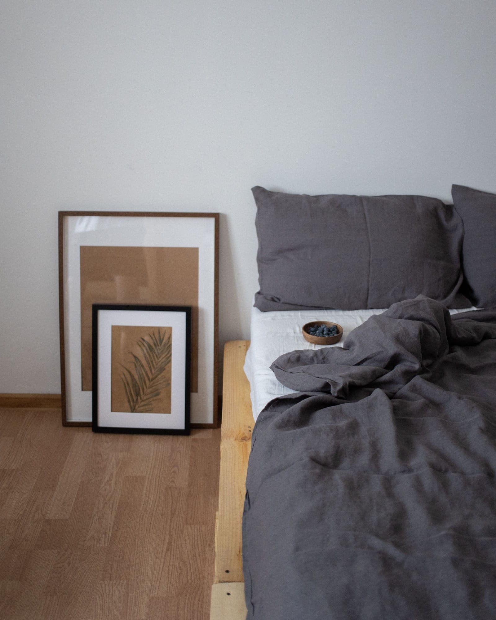 Charcoal bed sheets and pillowcases in a minimal bedroom