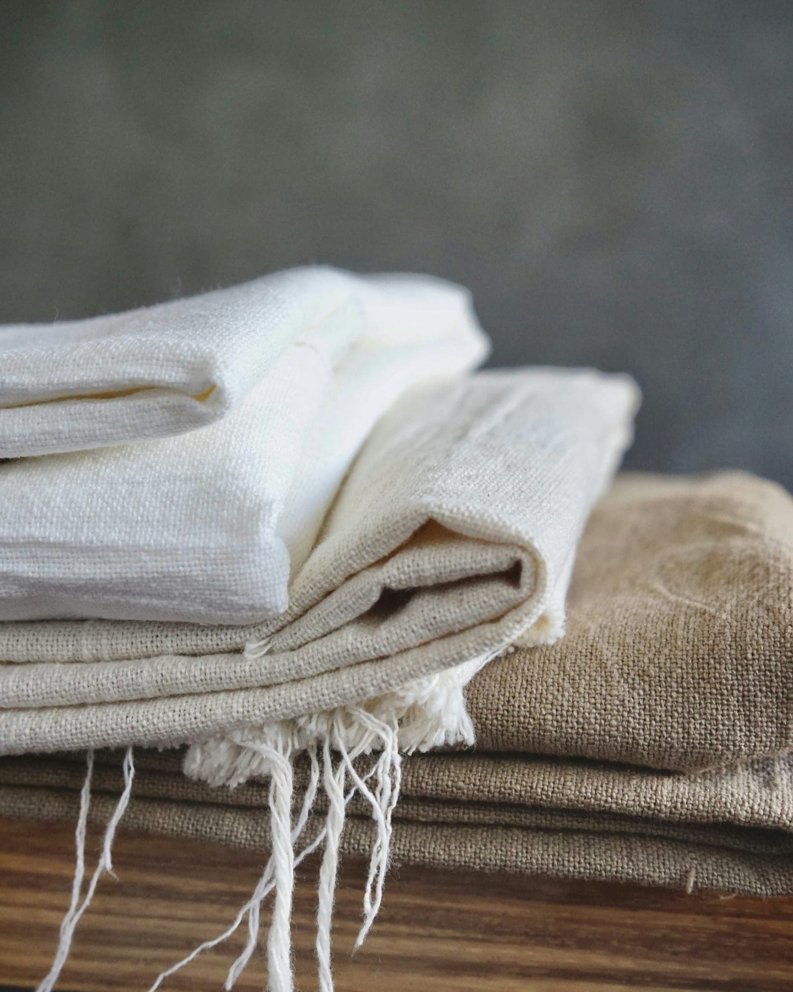 Freshly laundered bed linen folded and stacked