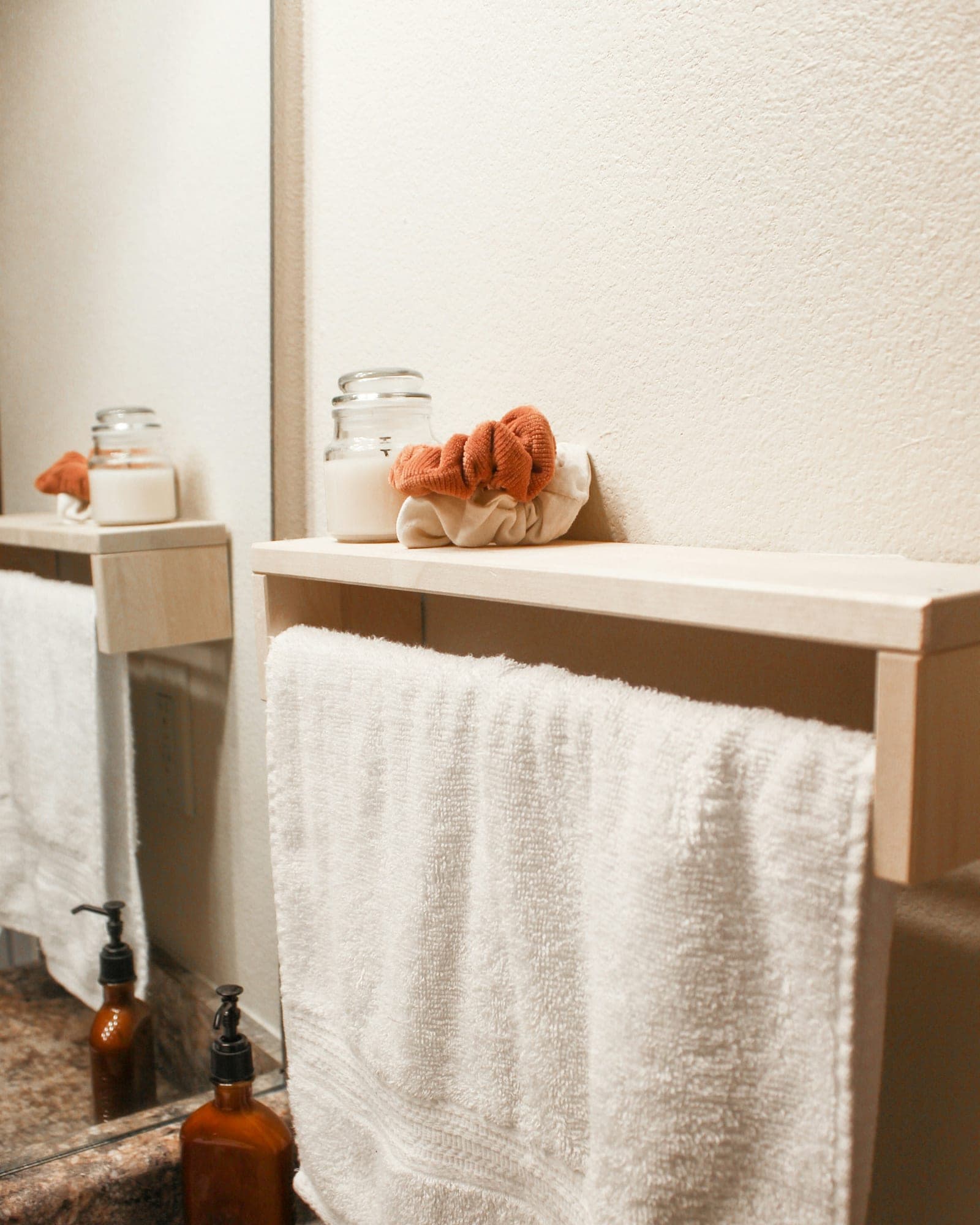 Pearl white bath towel hanging on a bathroom rail