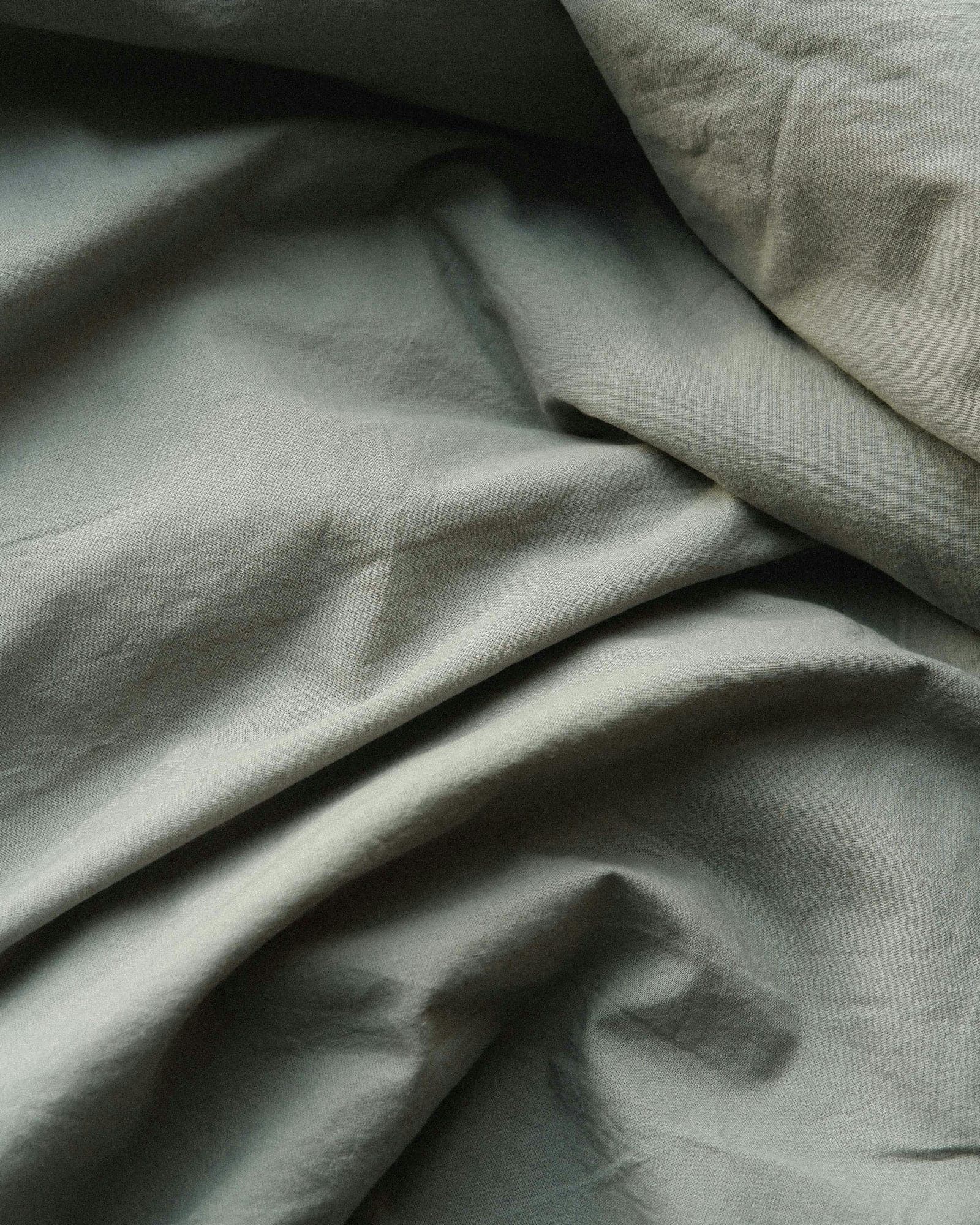 Close-up of sage green cotton