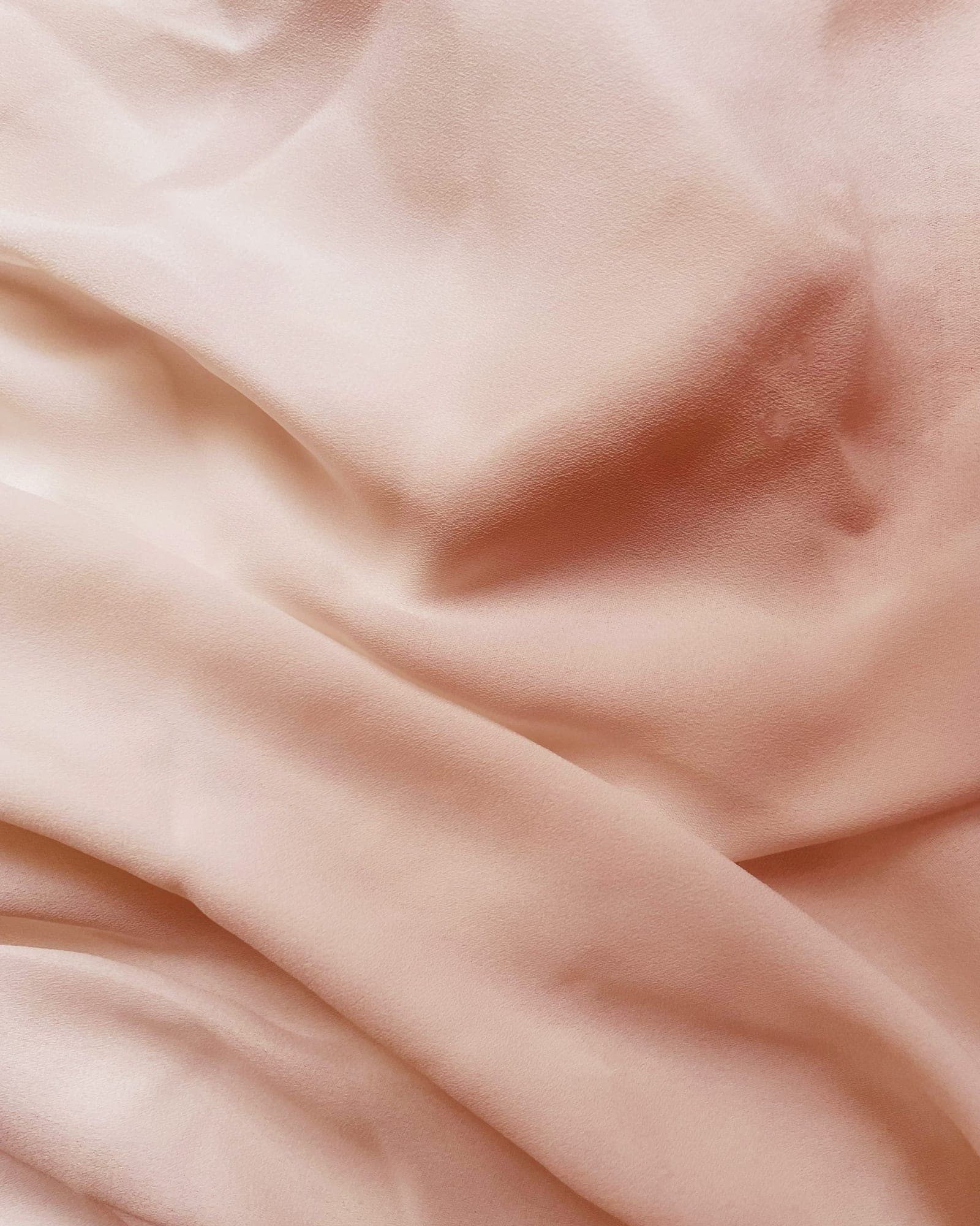 Close-up of dusty rose cotton sateen with a soft sheen